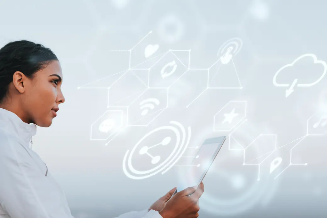 Architect reviewing a connected network of cloud and service components on a tablet